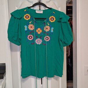 Cute embroidered floral top with tassels